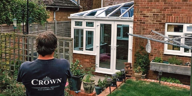 crown member looking at white conservatory