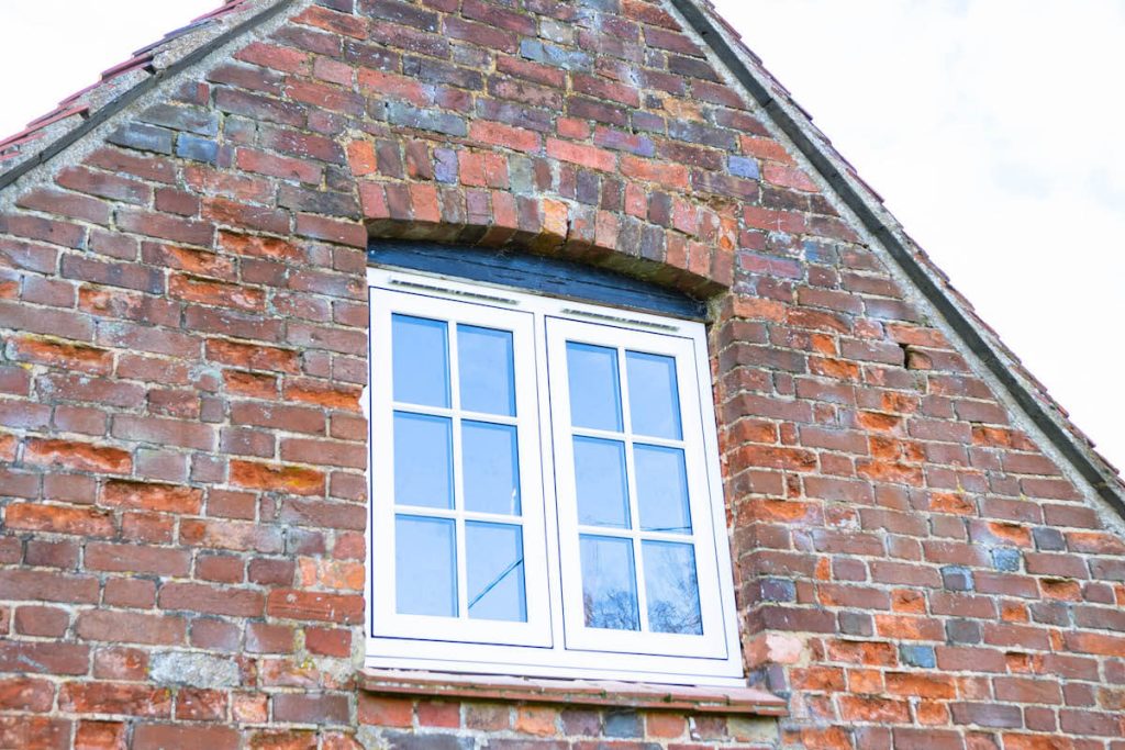 white flush windows with bars