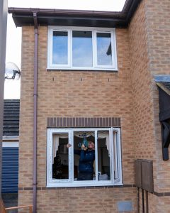 white upvc casement windows being installed