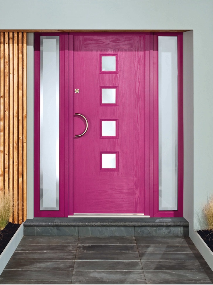 A vibrant purple composite door with four square glass panels, complemented by frosted glass side panels and a modern curved handle.