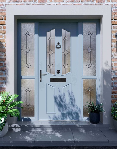 A light blue composite door with decorative glass panels and matching side windows, set within a brick exterior.